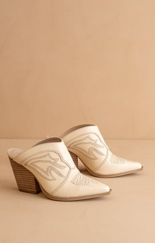 Ivory color Mule shoe with wood heel. The shoe is embroidered