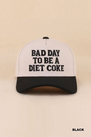 Trucker hat with 'Bad Day to be a Diet Coke' text on a beige background
