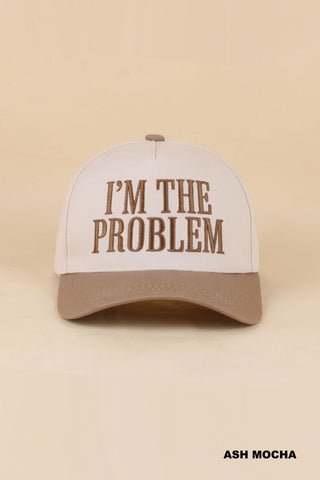 light brown bill baseball style cap that says "I'm the problem"