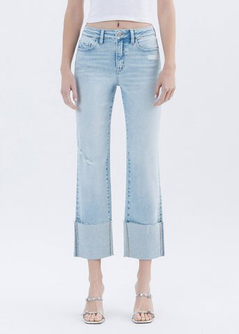 Light blue jeans worn by a person on a white background