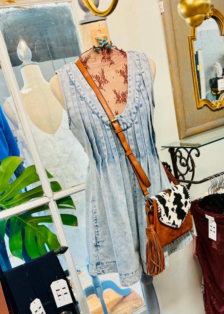 Acid washed shorts romper with yoke detailing, pockets, a discreet zipper and pleated