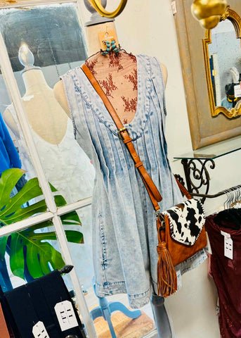 Acid washed shorts romper with yoke detailing, pockets, a discreet zipper and pleated
