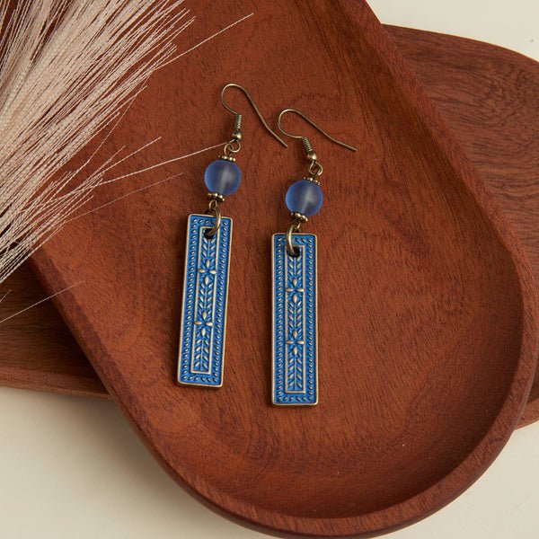 western inspired blue pendant style earrings
