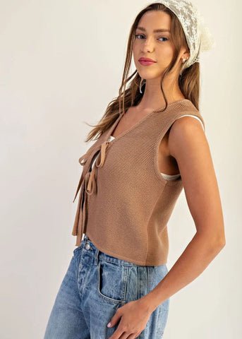 Taupe tie front vest design can be worn solo or layered.